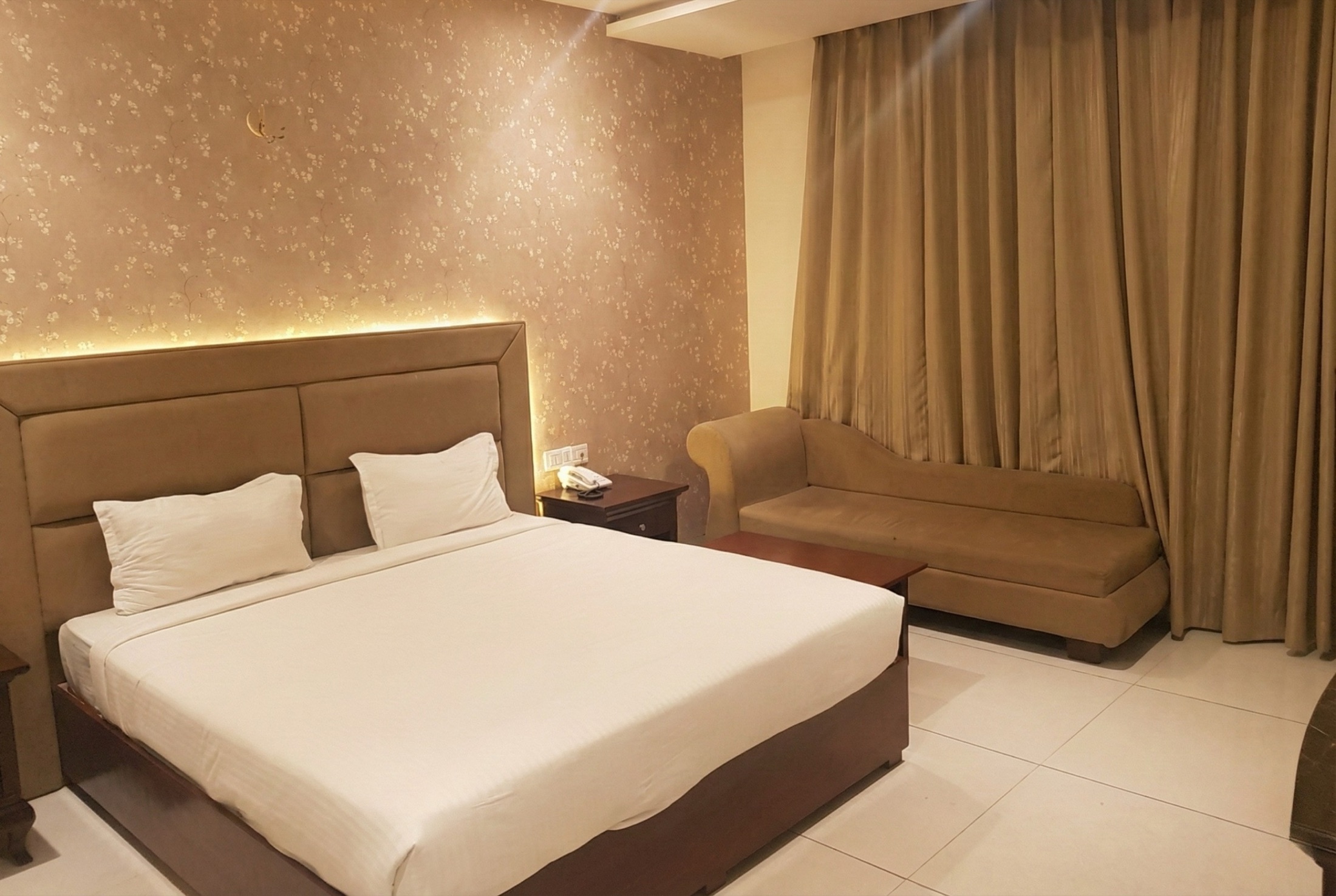 Warm beige guest room at Nakshatra